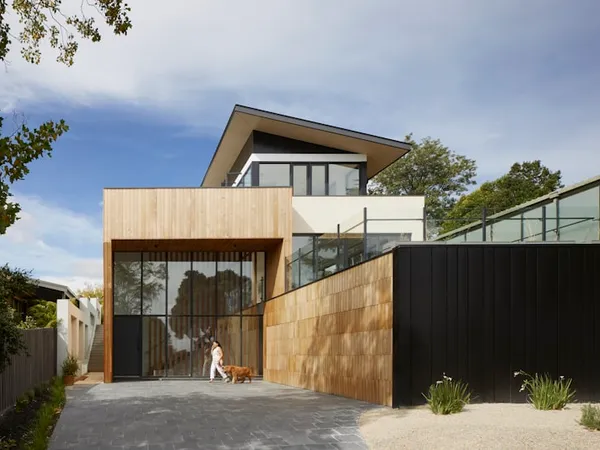 Hillside property with terraced gardens, stone stairway, and dining terrace